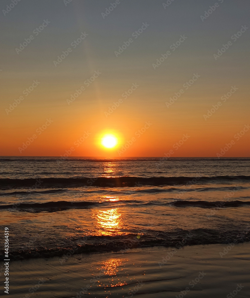 sunset in the ocean photo
