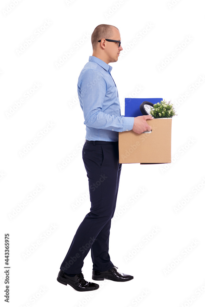 side view of business man walking with his belongings in cardboard box isolated on white side view of business man walking with his belongings in cardboard box isolated on white