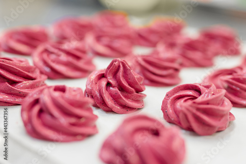 Wallpaper Mural Many red and pink cooked marshmallows lie on the table Torontodigital.ca