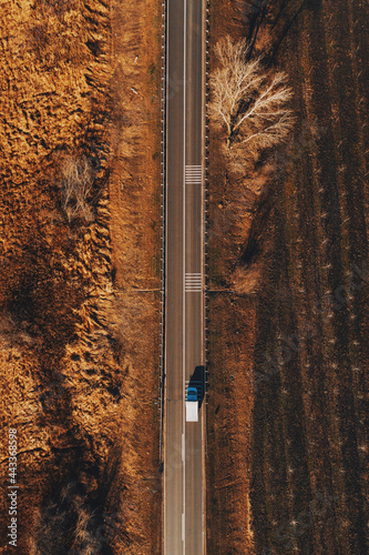 Mini truck on the road from above photo