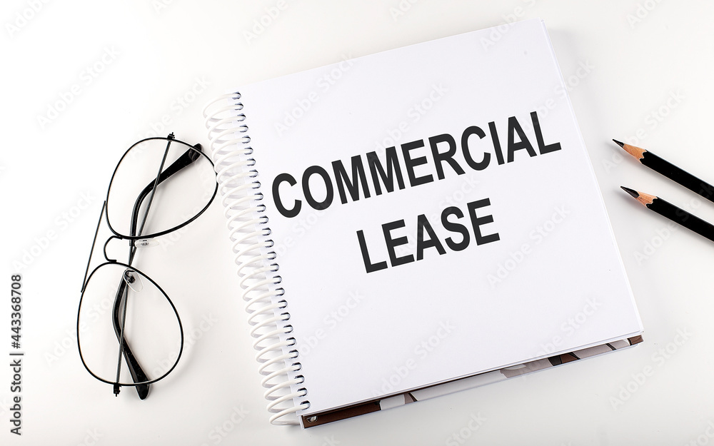 Notepad with text COMMERCIAL LEASE . White background. Business concept Notepad with text COMMERCIAL LEASE . White background. Business concept
