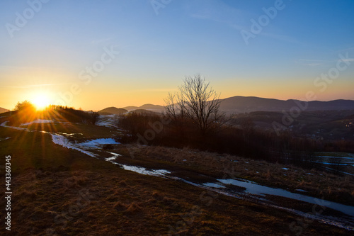 The setting sun in the mountains. Czarny Dzia   in Beskid Wyspowy. Wilkowisko.