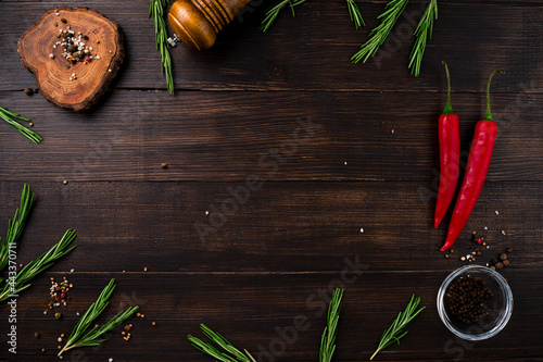 Obraz na płótnie Herbs and spices at wooden table. Cooking or food background. Food ingredients. w salonie