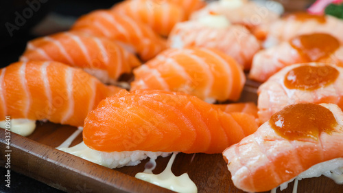 Salmon Sushi Japanese food. on the table in restaurant. Japanese cuisine set of Sashimi Salmon sushi nigiri. 
