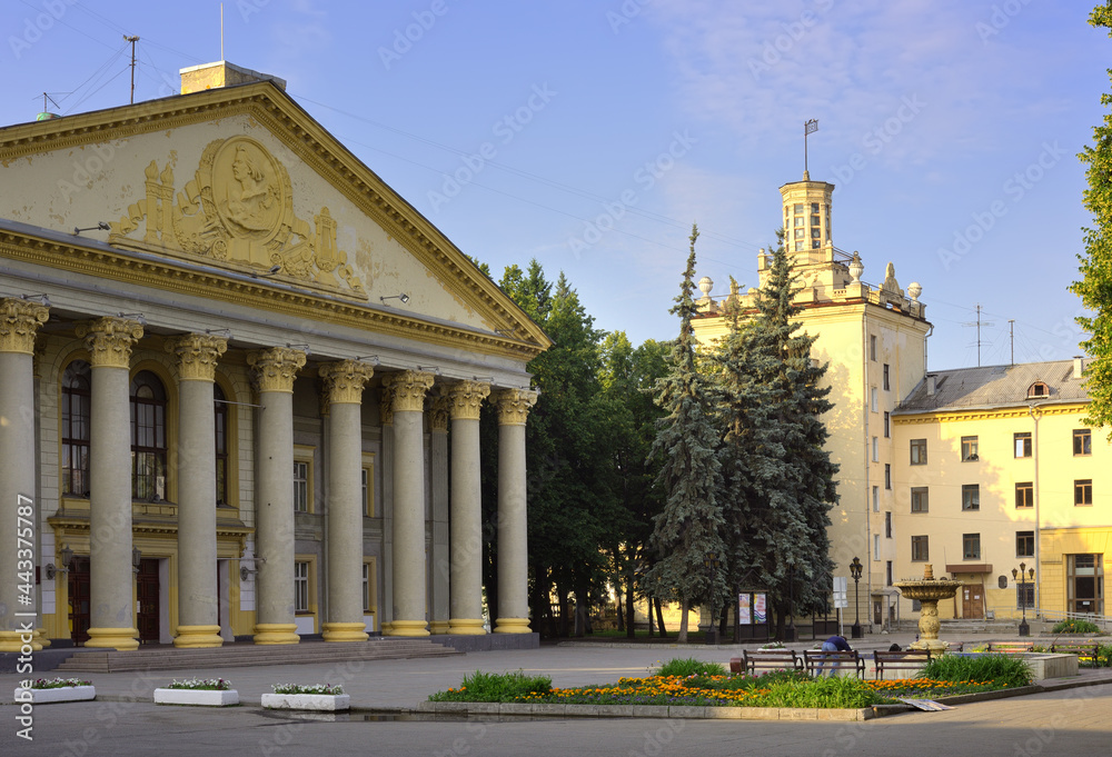 The square near the Gorky House of Culture. An architectural monument of Soviet classicism, an entrance portico of the Corinthian order, a residential with a tower. Novosibirsk, Siberia, Russia