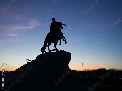 the silhouette of the bronze horseman against the background of the evening sky in St. Petersburg