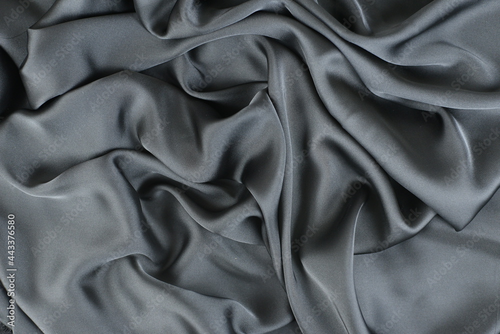 Smooth elegant silk or satin texture can use as abstract background. Luxurious background design