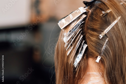 Airtouch technique. Hair stylist dyes hair