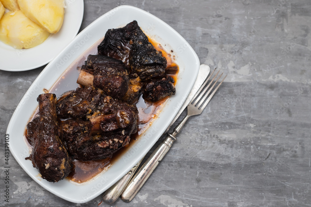 Old goat meat dish Chanfana, traditional portuguese, roasted in pans.