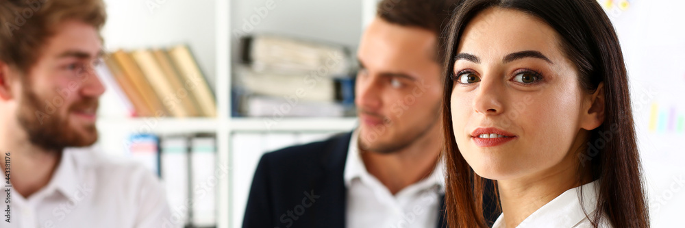 Beautiful smiling cheerful girl at workplace