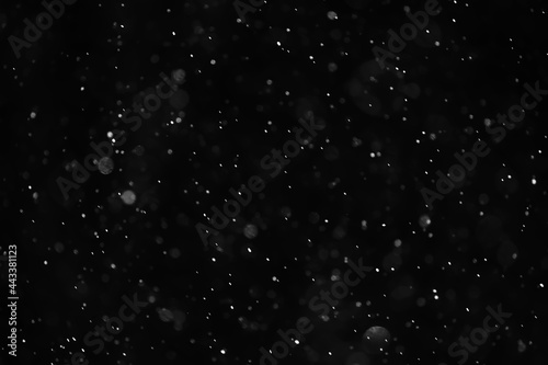 snow black background abstract texture  snowflakes falling in the sky overlay