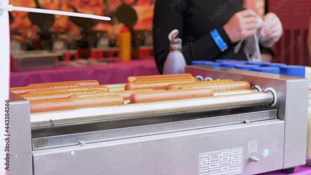 Cooking Juicy, Fried Sausages on a Skewer, Grill. Grilled Rotating