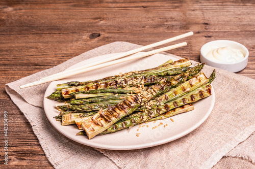 Ripe grilled asparagus. Wooden cutlery, healthy food concept