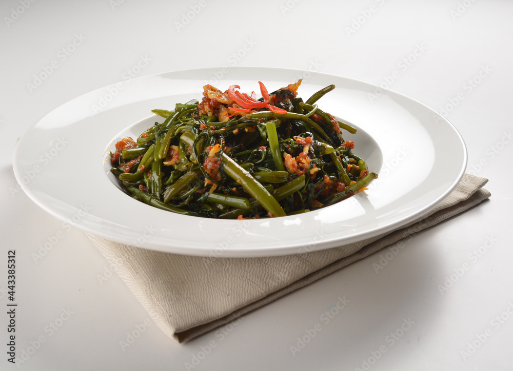 stir fried kang kong vegetable with spicy sambal chilli sauce in white plate asian halal menu stir fried kang kong vegetable with spicy sambal chilli sauce in white plate asian halal menu