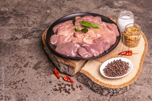 Raw chicken liver with spice set ready for cooking photo