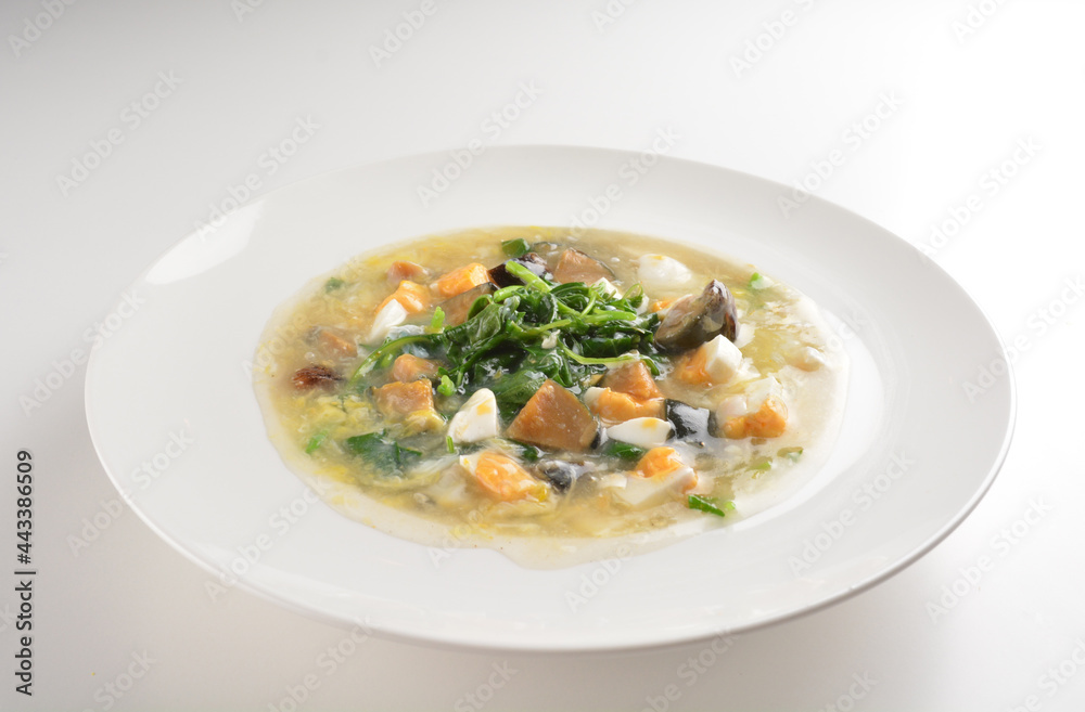 stir fried water spinach vegetable with trio eggs in thick gravy sauce in white plate asian halal menu stir fried water spinach vegetable with trio eggs in thick gravy sauce in white plate asian halal menu