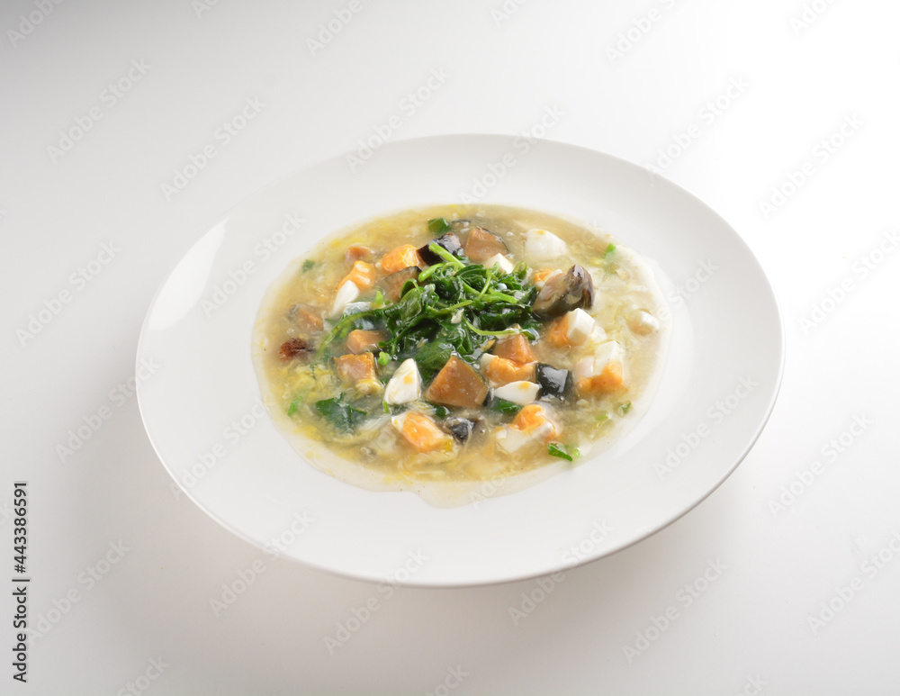 stir fried water spinach vegetable with trio eggs in thick gravy sauce in white plate asian halal menu stir fried water spinach vegetable with trio eggs in thick gravy sauce in white plate asian halal menu