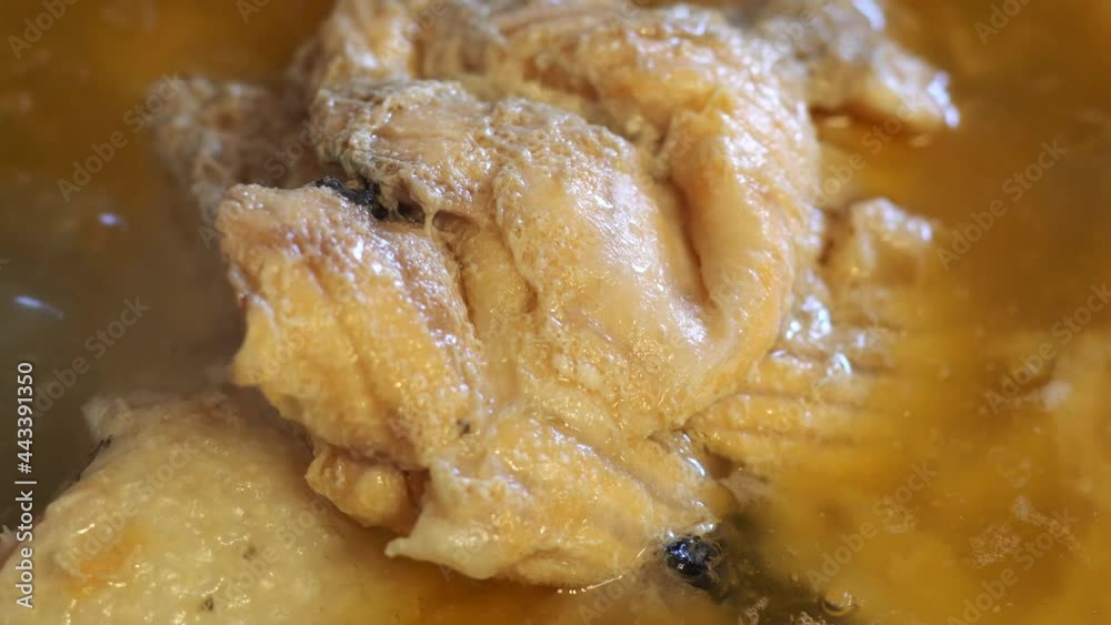 Salmon fish is cooked in a saucepan. Macro view. Fish soup. Salmon fish is cooked in a saucepan. Macro view. Fish soup.