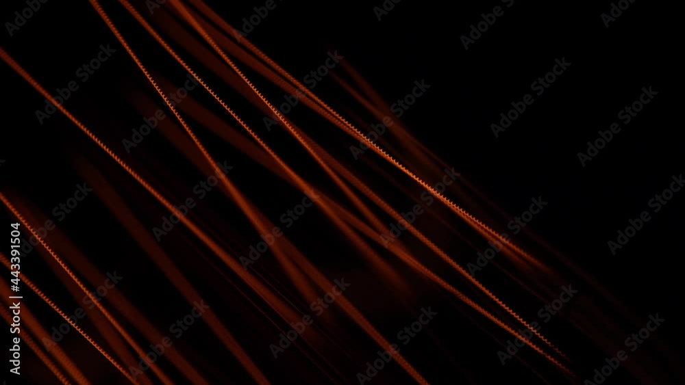 Glass bulb of a lamp. Extremely close view. Macro. Tungsten filaments glow with a warm orange light. The spiral vibrates with electricity.