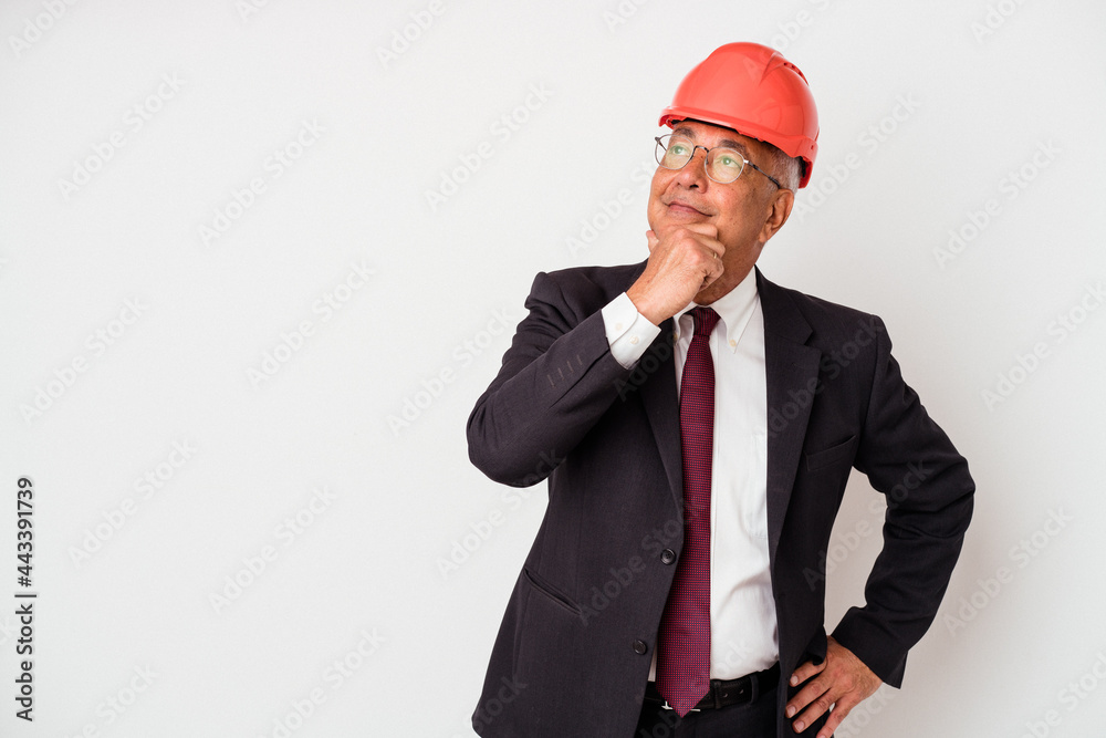 Senior american arquitech man isolated on white background looking sideways with doubtful and skeptical expression. Senior american arquitech man isolated on white background looking sideways with doubtful and skeptical expression.