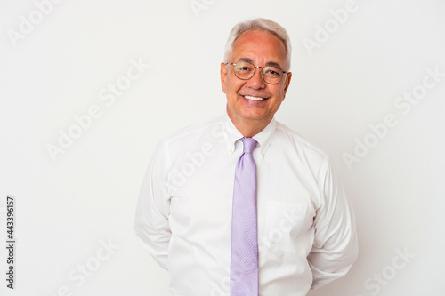 Senior american man isolated on white background happy, smiling and cheerful. © Asier