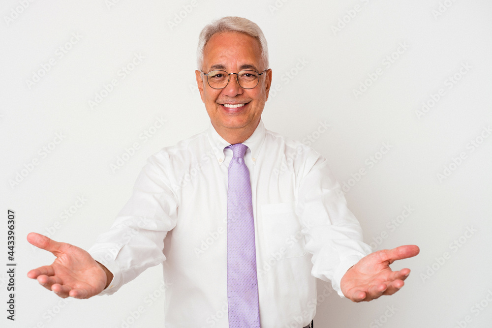 Senior american man isolated on white background showing a welcome expression. Senior american man isolated on white background showing a welcome expression.
