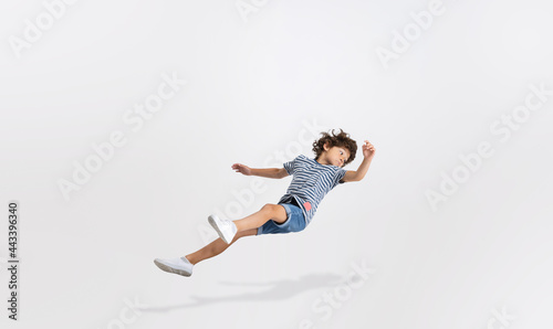 Portrait of Caucasian preschool boy isolated over white studio background. Copyspace. Childhood, education, emotions concept
