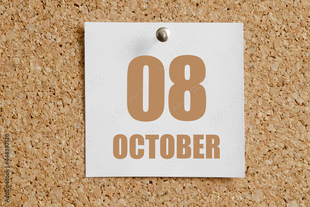 october 08. 08th day of the month, calendar date.White calendar sheet attached to brown cork board.Autumn month, day of the year concept october 08. 08th day of the month, calendar date.White calendar sheet attached to brown cork board.Autumn month, day of the year concept