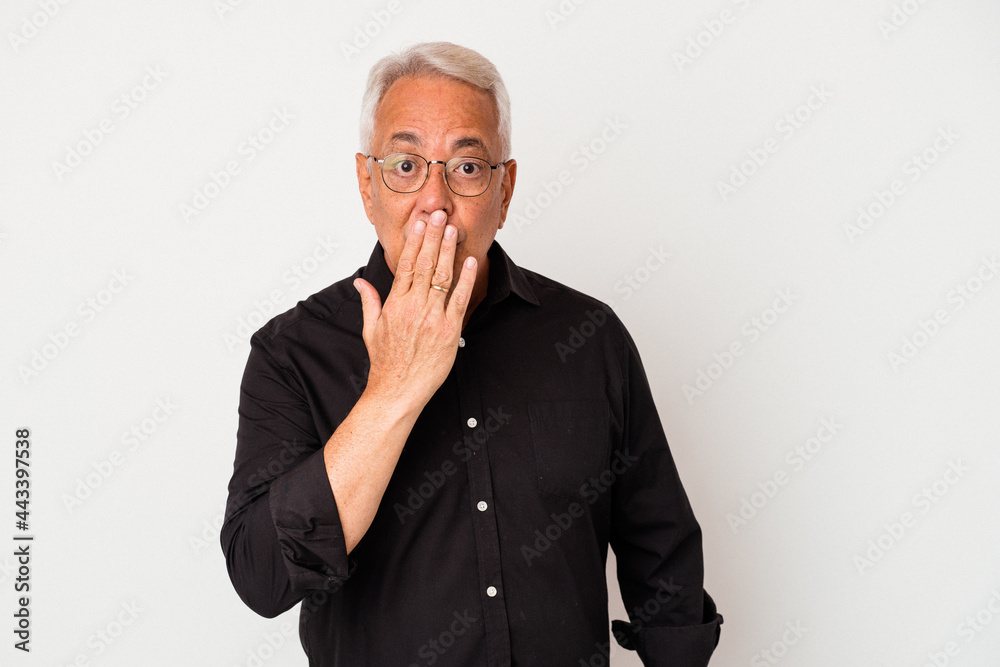 Senior american man isolated on white background shocked, covering mouth with hands, anxious to discover something new. Senior american man isolated on white background shocked, covering mouth with hands, anxious to discover something new.
