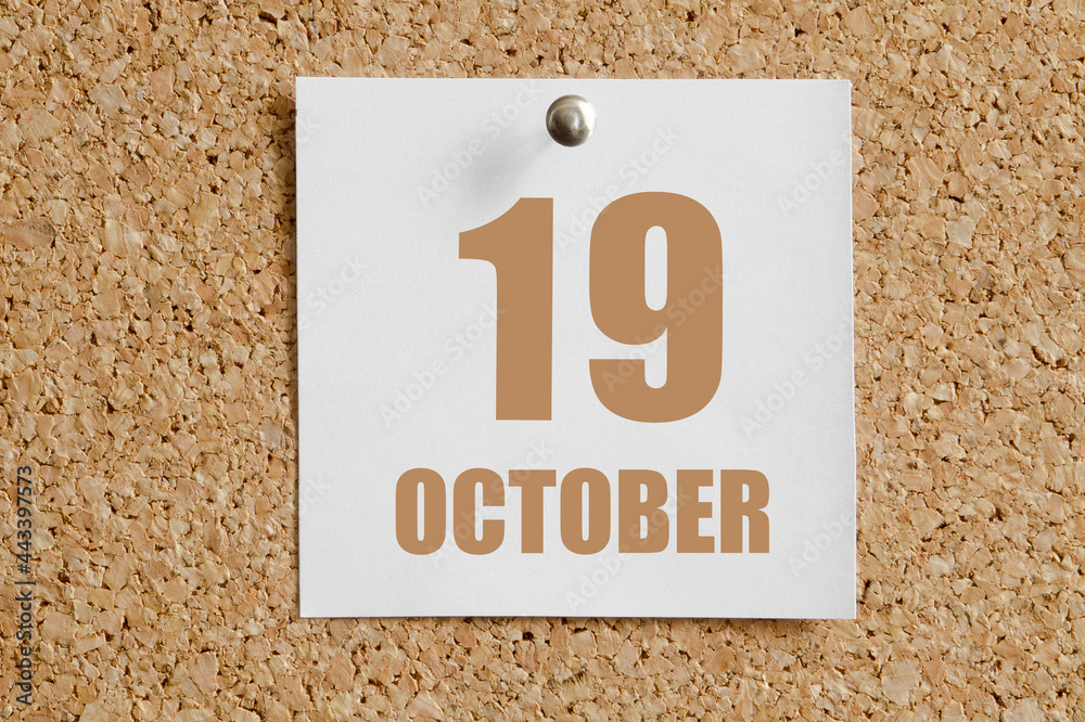 october 19. 19th day of the month, calendar date.White calendar sheet attached to brown cork board.Autumn month, day of the year concept october 19. 19th day of the month, calendar date.White calendar sheet attached to brown cork board.Autumn month, day of the year concept
