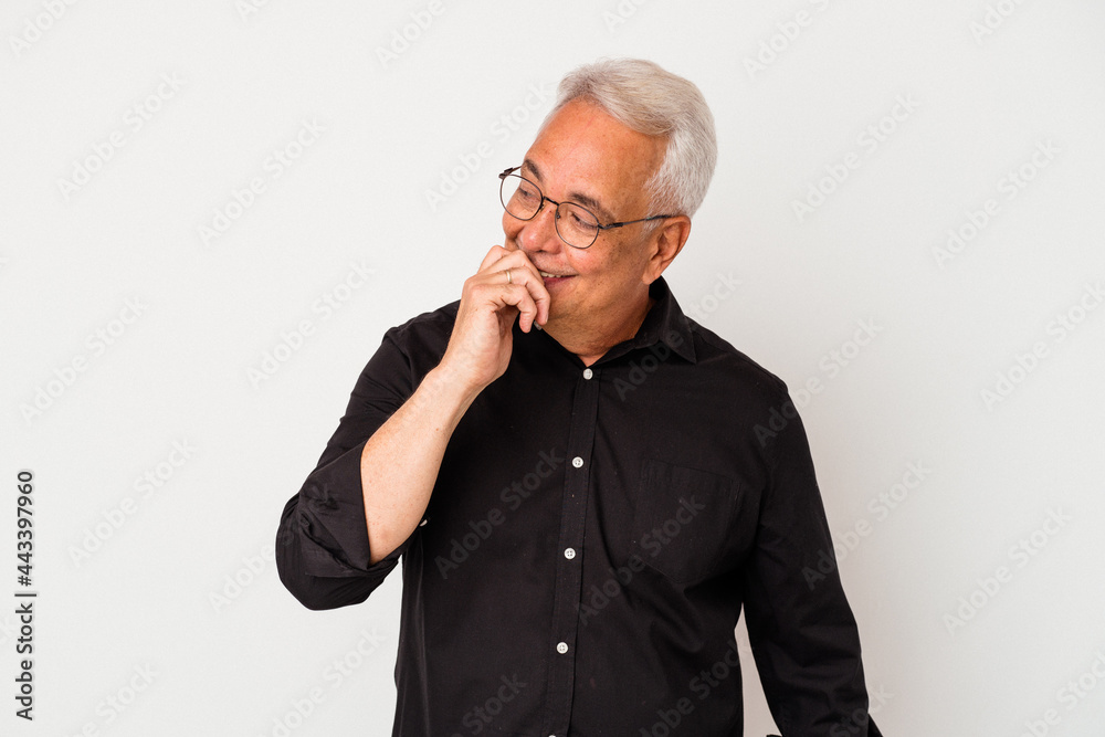 Senior american man isolated on white background relaxed thinking about something looking at a copy space.
