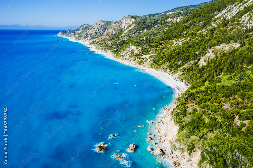 Aerial view of Lefkada coastline. Beautiful beaches, mountains, cypress and pine tree vegetation. Ionian Sea, Greece.