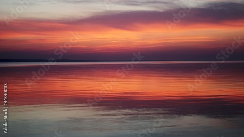 sunset in the sea. sunset at the beach. sunset over the sea. © Oksana