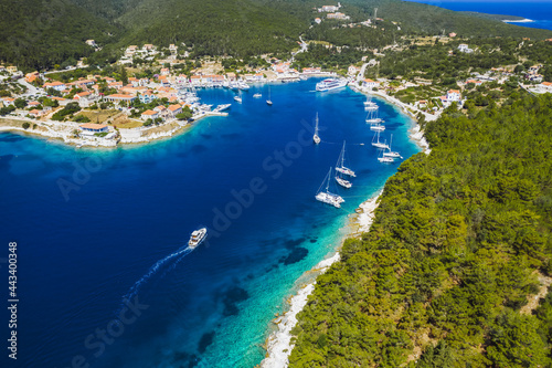 Beautiful Fiscardo village at Kefalonia island. Port with yacht boats and a ferry