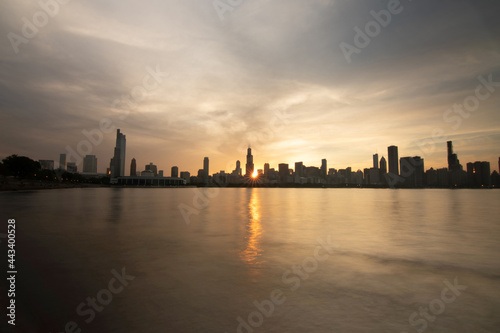 Evening Chicago Skyline with setting sun and city buildings  Chicago  USA
