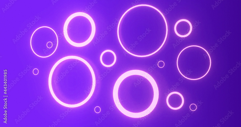 Pulsating pink neon rings in various sizes glowing on purple background