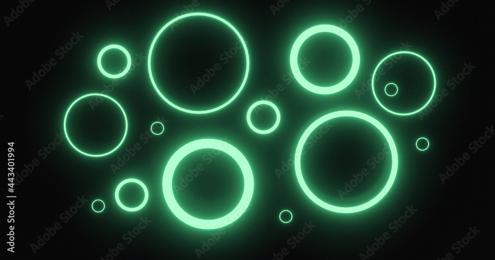 Pulsating green neon rings in various sizes glowing on black background and tilting