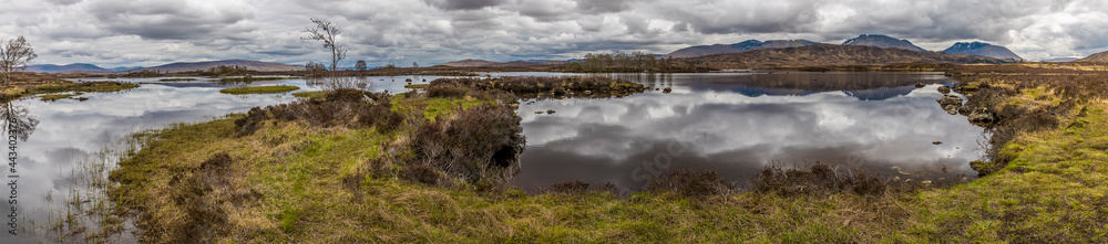 A panorama view across Loch Ba and Rannoch Moor near Glencoe, Scotland on a summers day