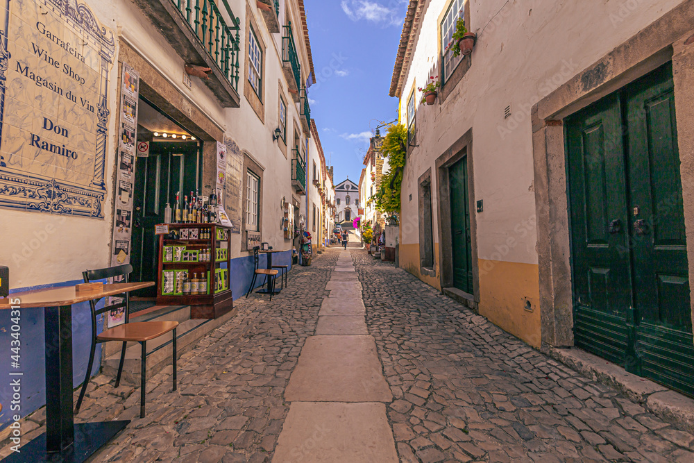 Obraz premium Óbidos - June 29, 2021: Street view of the medieval town of Óbidos, Portugal