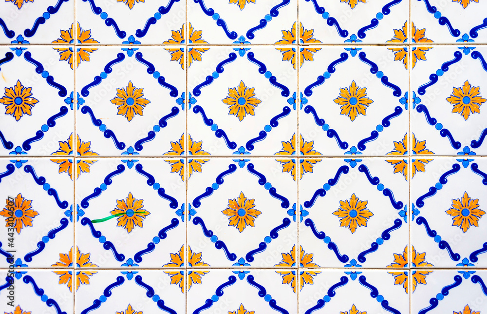Old tiles wall on the street azulejos ceramic tile work. Porto, Portugal. - obrazy, fototapety, plakaty 