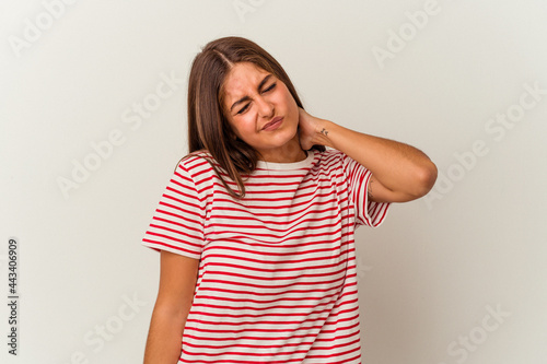 Young caucasian woman isolated on white background pointing to different copy spaces, choosing one of them, showing with finger.