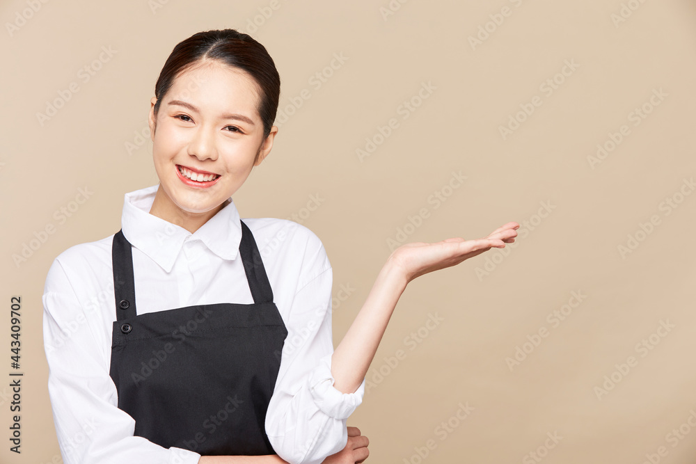Portrait of asian waitress beaufitul female is howing OK hand gesture with happy smiling at isolate blank empty background studio Portrait of asian waitress beaufitul female is howing OK hand gesture with happy smiling at isolate blank empty background studio