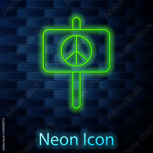 Glowing neon line Peace icon isolated on brick wall background. Hippie symbol of peace. Vector