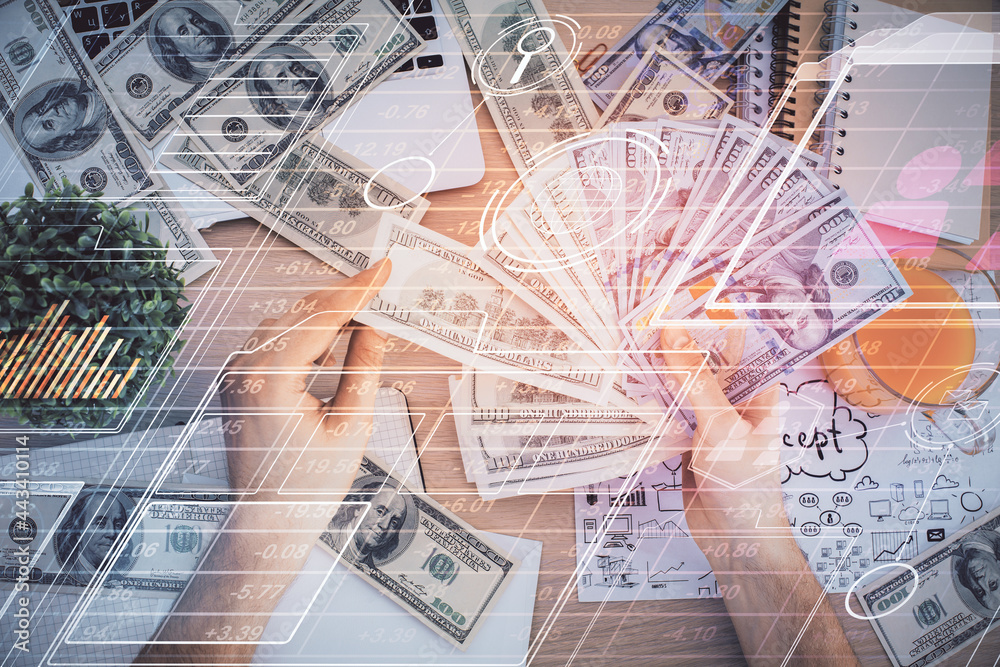 Multi exposure of technology drawing hologram and us dollars bills and man hands. Data concept