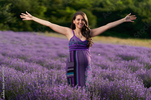 Fototapeta Naklejka Na Ścianę i Meble -  Pregnant woman in a lavender field