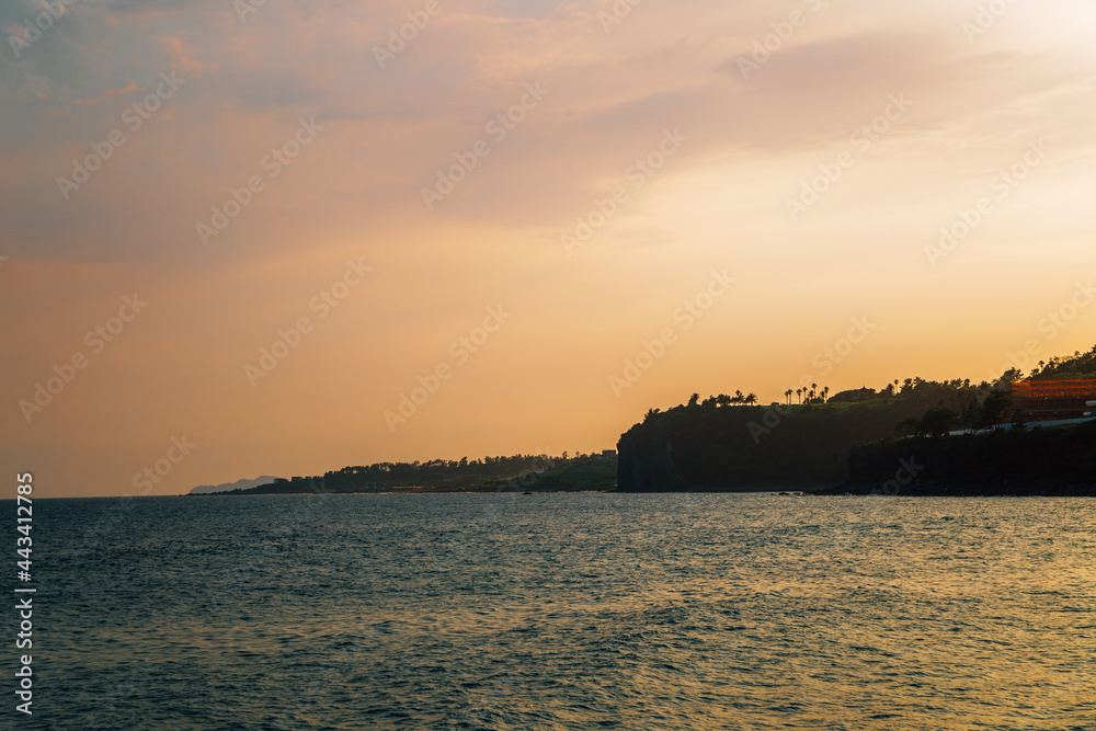 Sunset of Jungmun Saekdal Beach in Jeju Island, Korea Sunset of Jungmun Saekdal Beach in Jeju Island, Korea