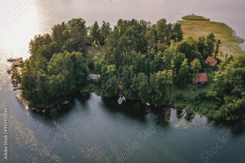 Isle on a Narie Lake in Warmia and Mazury region of Poland, view from Kretowiny village photo