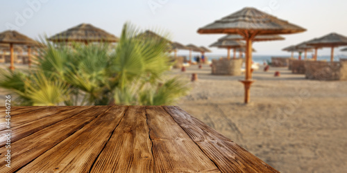 Desk of free space and summer background of beach 