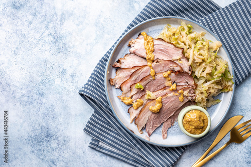 Bavarian pork knuckle with sauerkraut with mustard