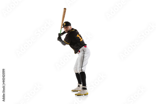Canvas Print Baseball player, pitcher in a black white sports uniform practicing isolated on a white studio background